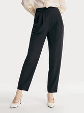 a woman in black pants
